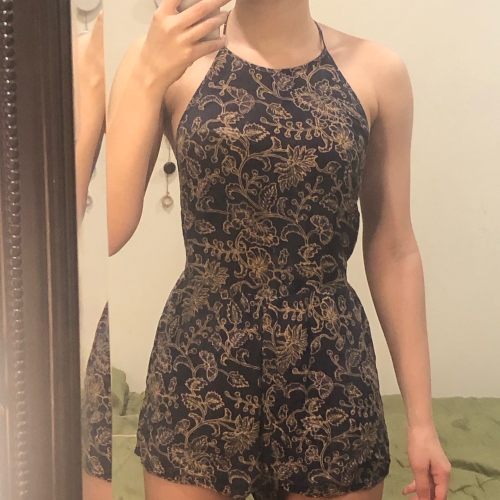 NAVY OUT FROM UNDER FLORAL HALTER SAVANNAH ROMPER